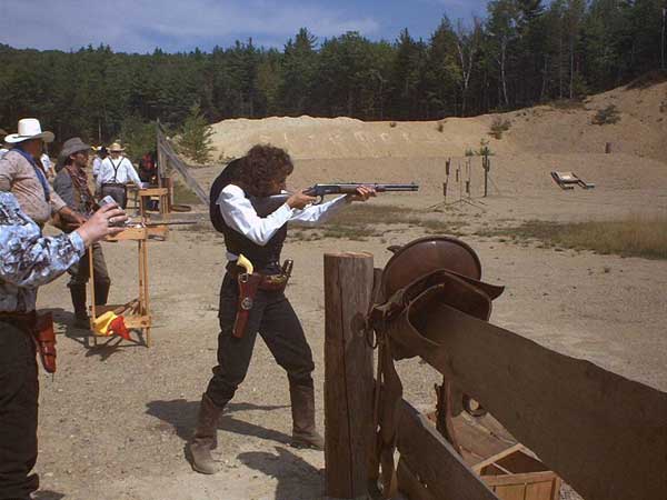 Gina Justice shooting rifle.