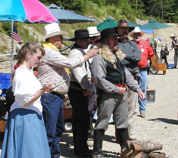 Iona Gunn keeping score while Wild Bill Blackerby bellows a line.