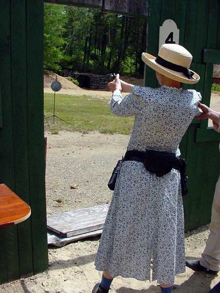 Patience Johnson shooting pistol.