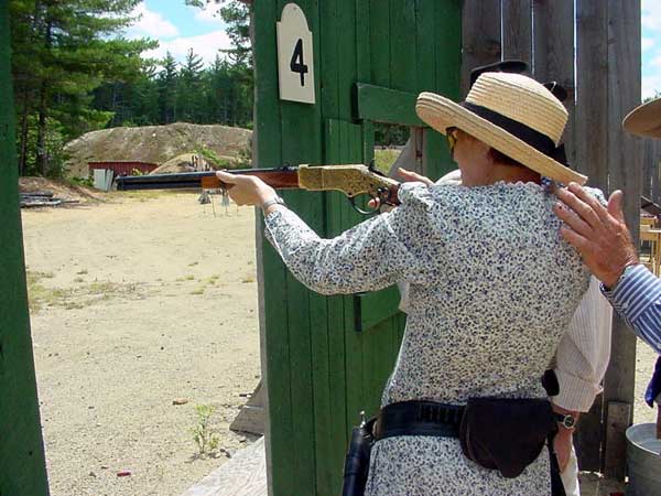 Patience Johnson shooting rifle.